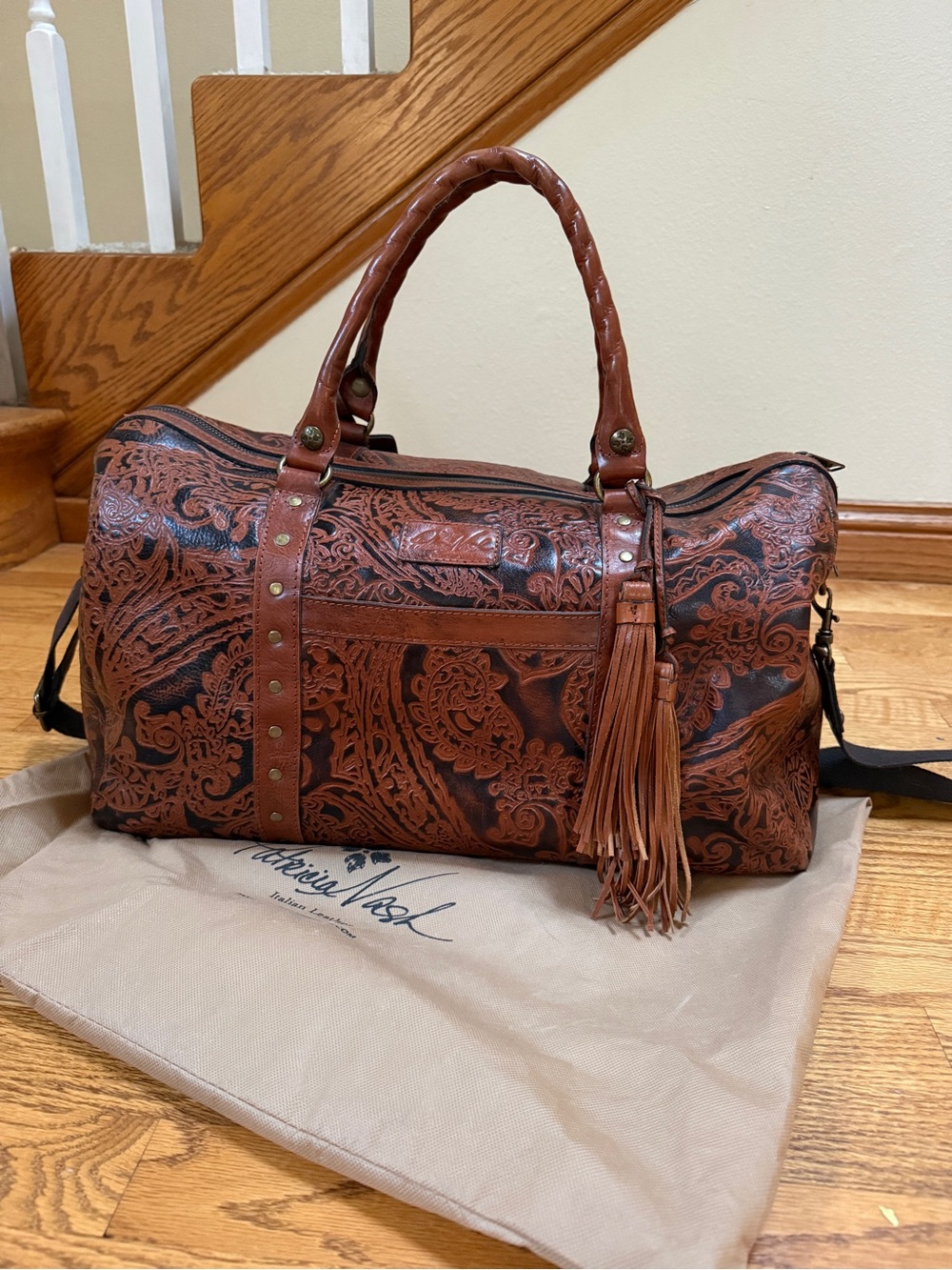 Patricia Nash Tooled Brown Leather Duffle Bag with Tassel & travel tag.